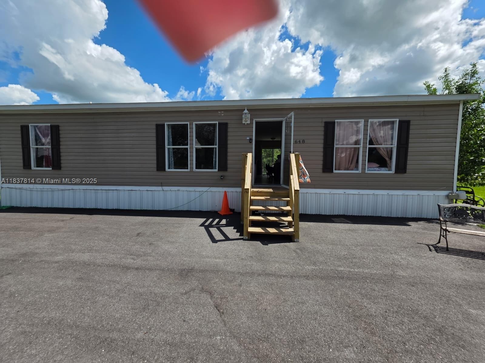 Single-family home at 648 Avenida del Sur, Clewiston — photo 1
