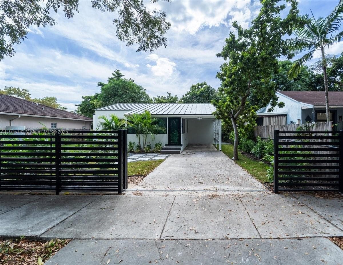 Single-family home at 5220 SW 6 ST, Miami, FL