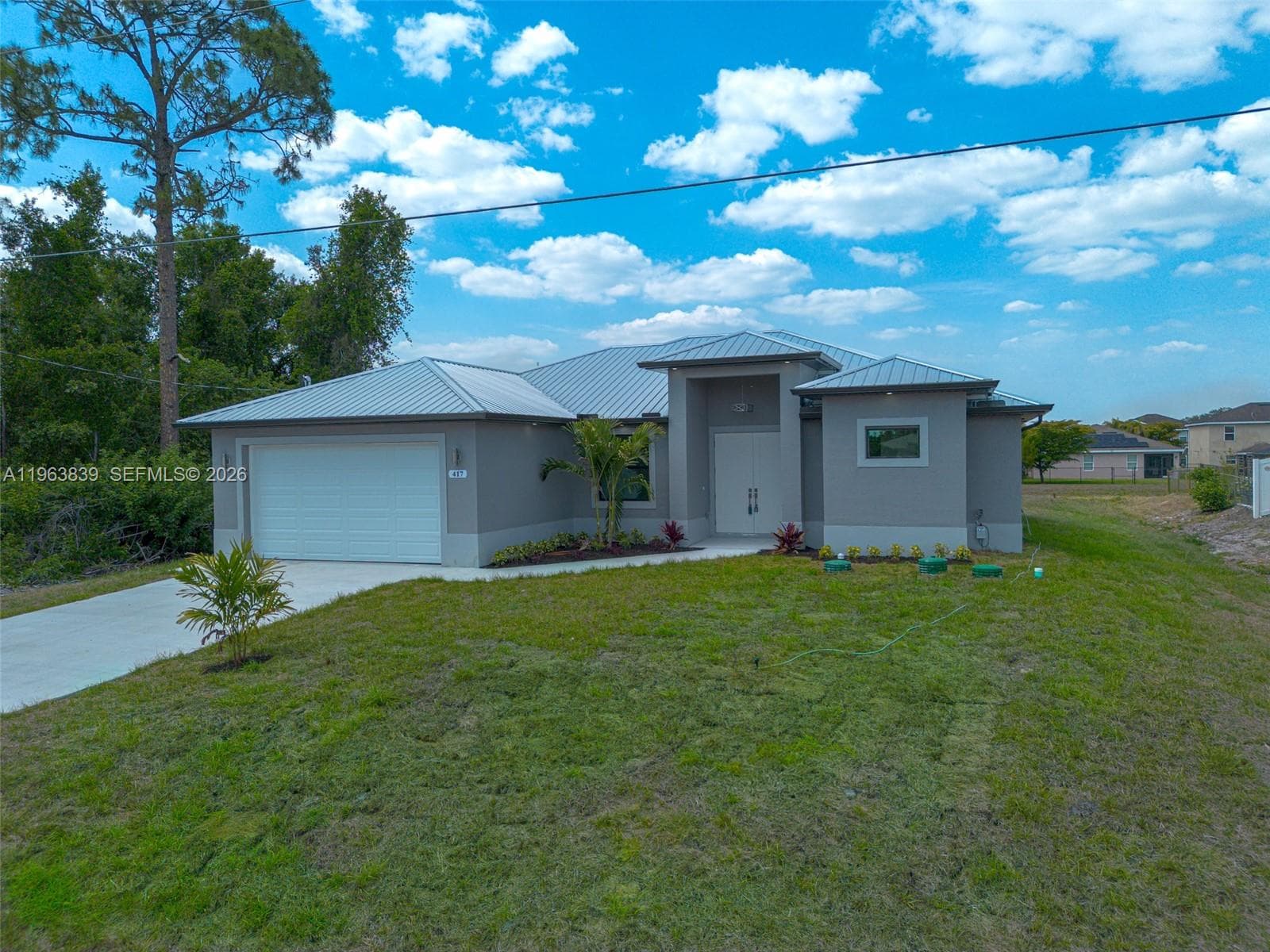 Single-family home at 417 Paddock St, Lehigh Acres — photo 1