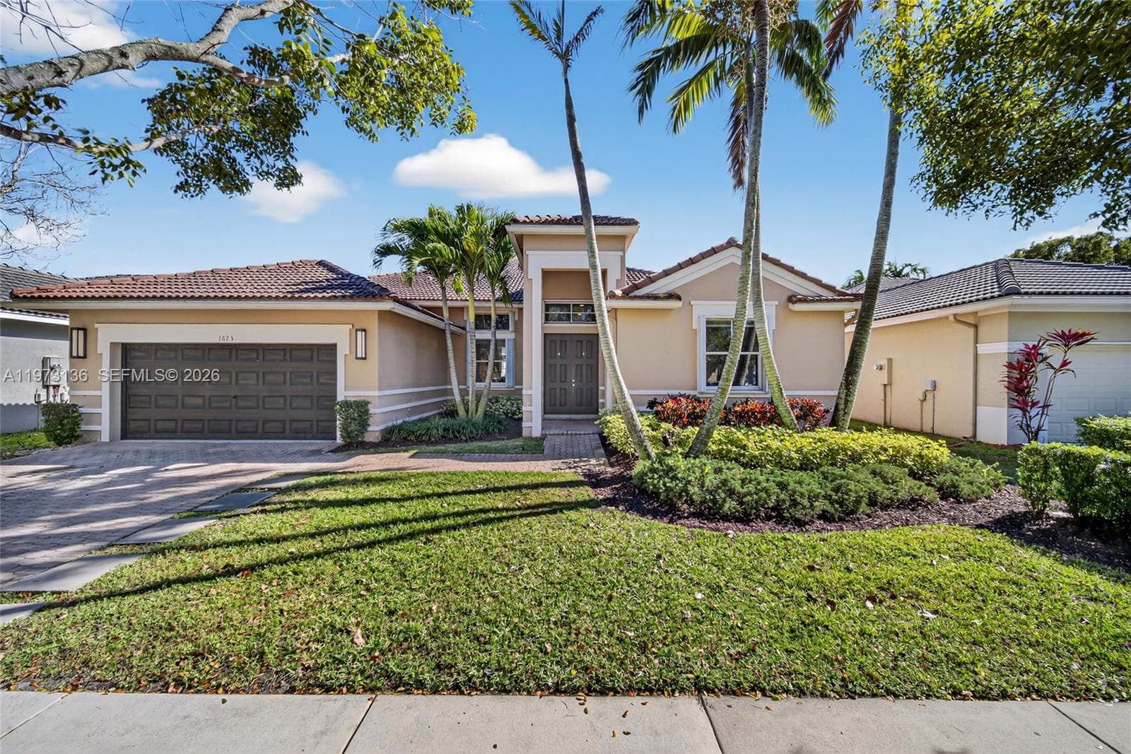 Single-family home at 1623 Blue Jay Cir, Weston — photo 1