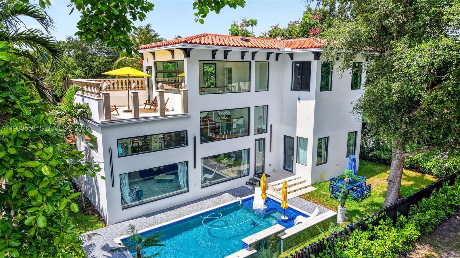 Single-family home at 941 NE 119th St, Biscayne Park, FL