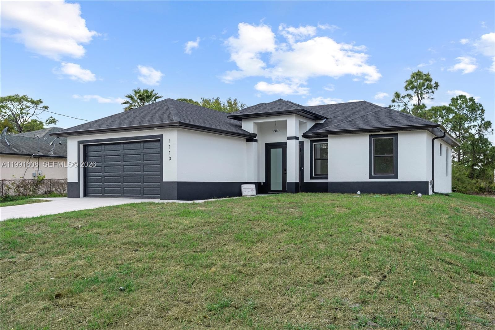 Single-family home at 1113 ENRIQUE ST E, Lehigh Acres, FL