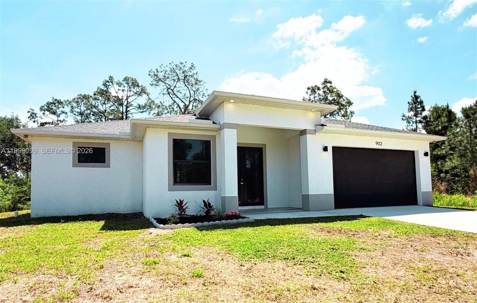 Single-family home at 902 MAGNOLIA AVE, Lehigh Acres, FL