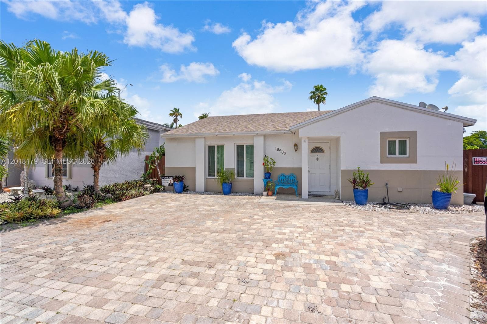 Single-family home at 19903 NW 67th Ct, Hialeah, FL