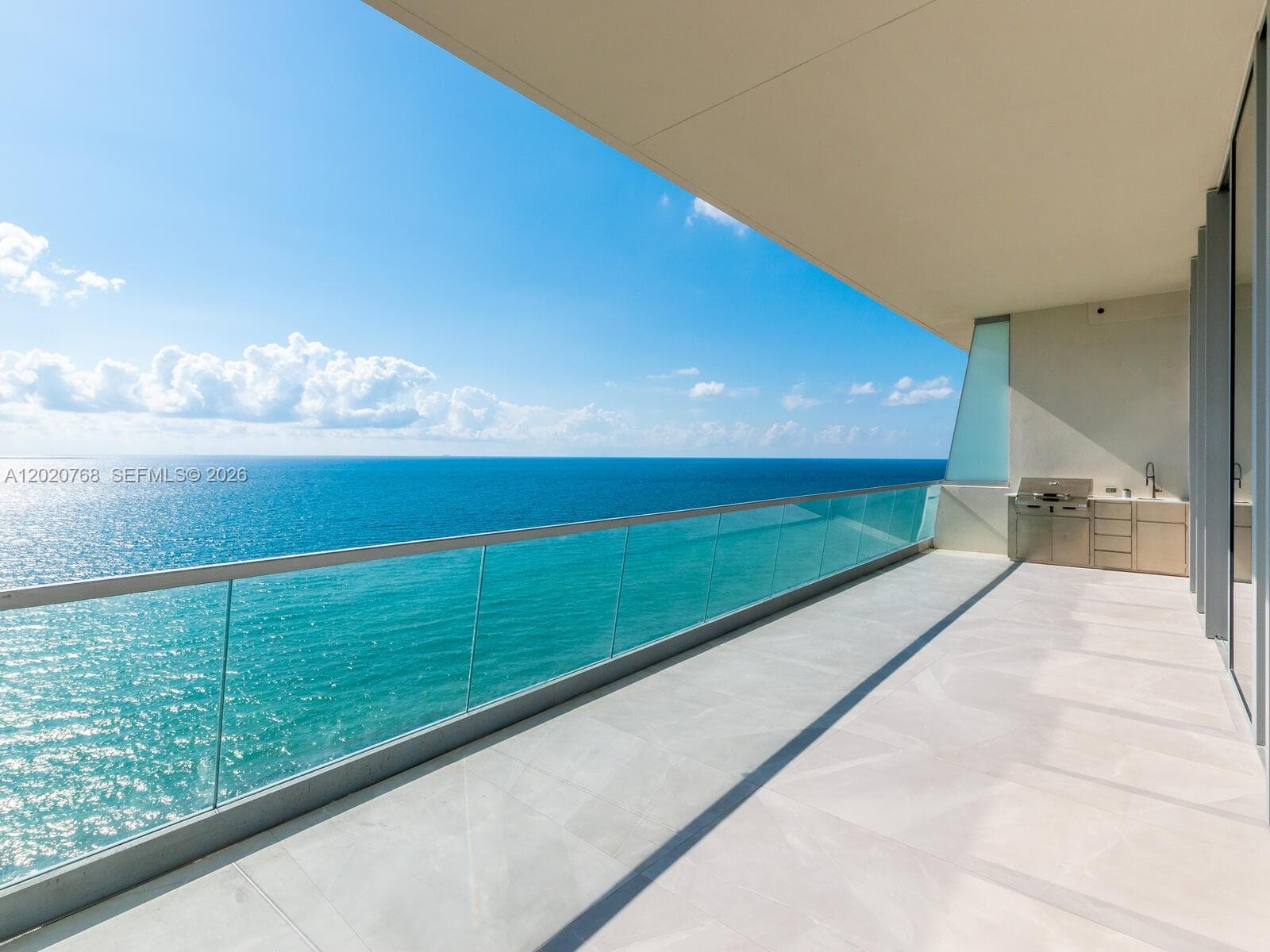 SUNRISE TERRACE. Enjoy this stunning Ocean view from living area and master bedroom. Summer kitchen included.