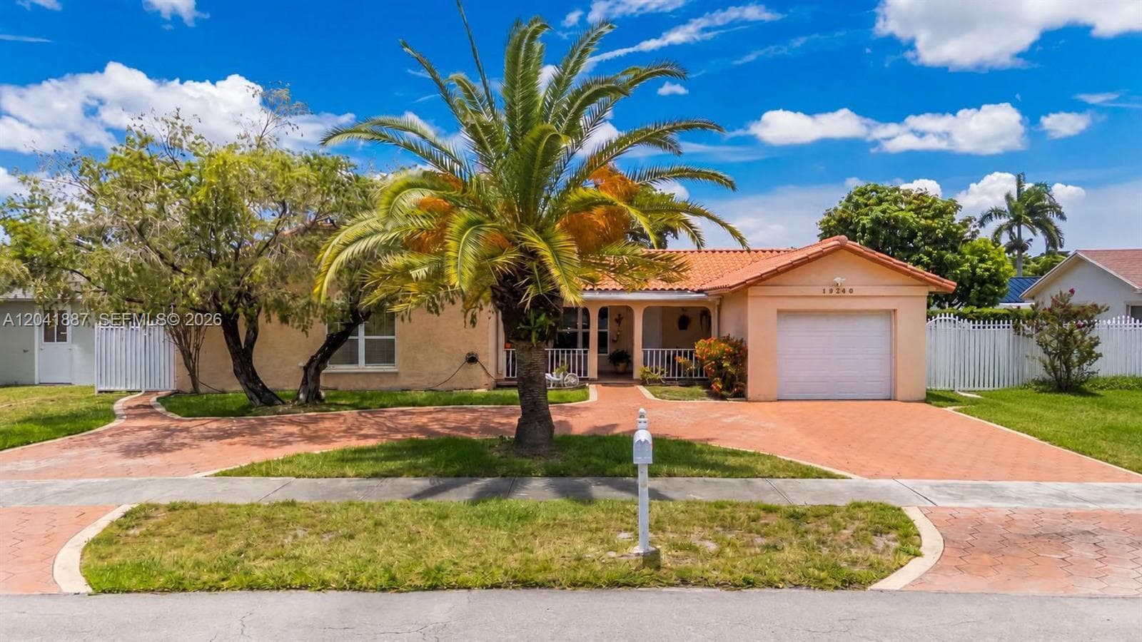 Single-family home at 19240 NW 60th Ct, Hialeah, FL