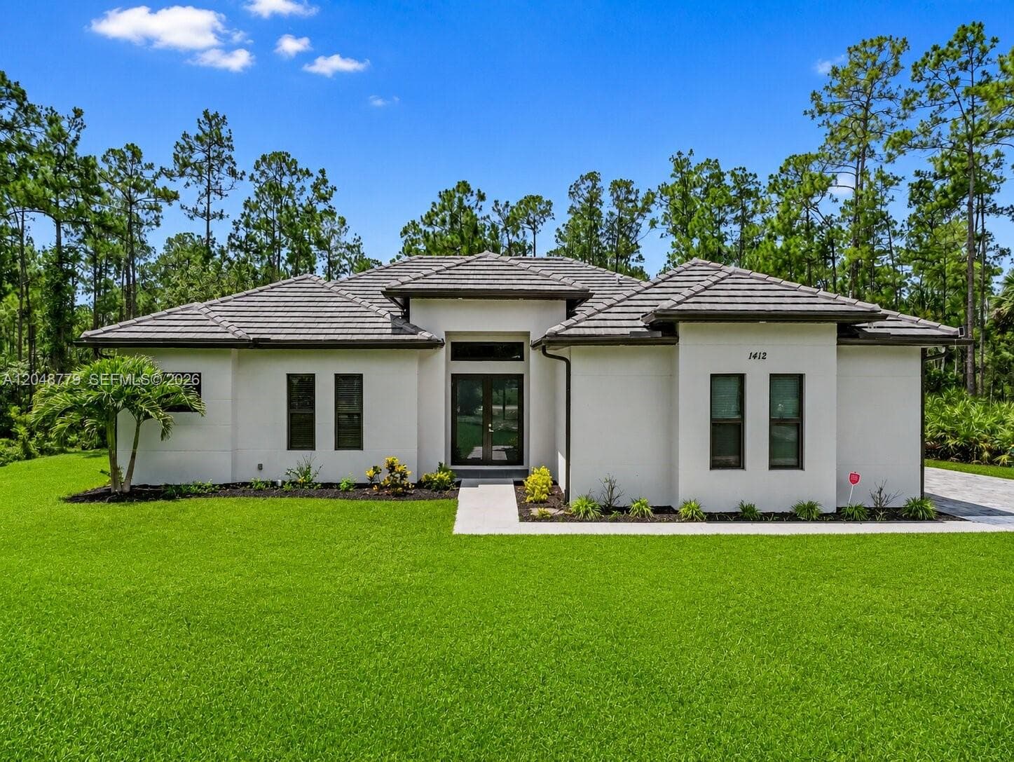 Single-family home at 1412 22nd Ave NE, Naples, FL