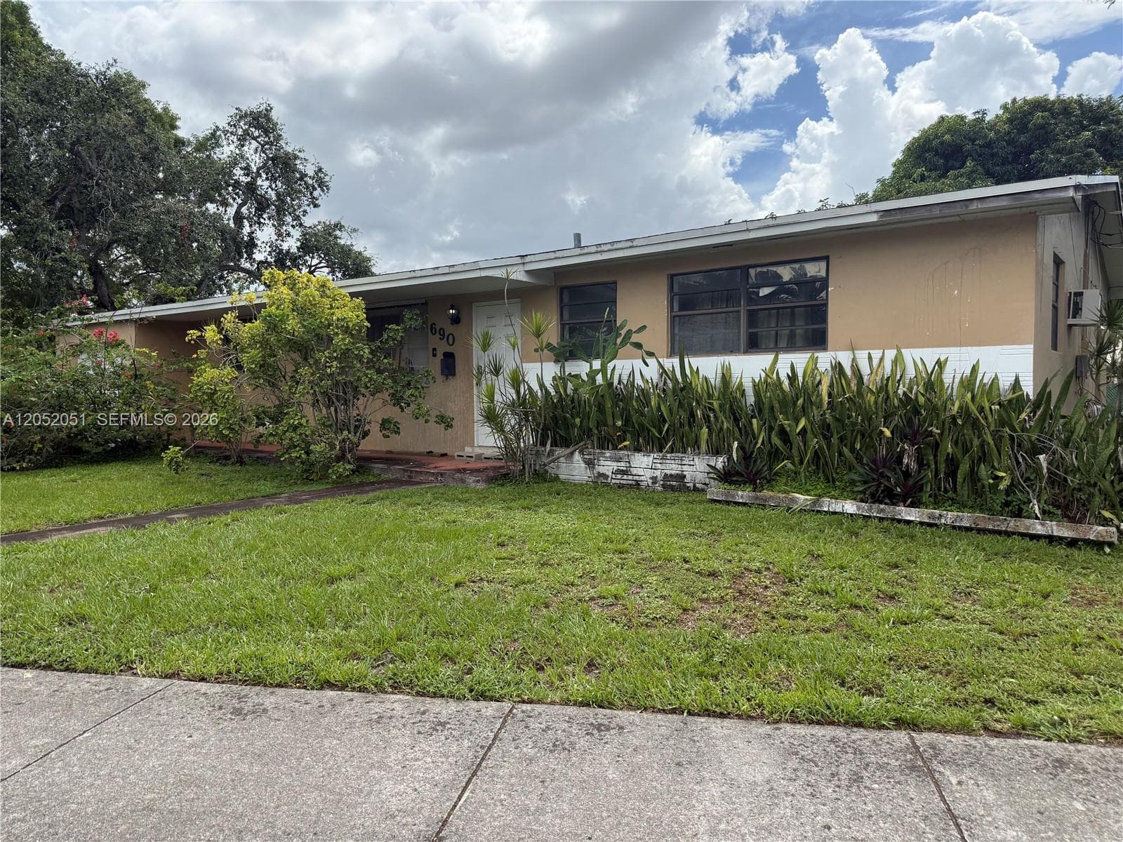 Single-family home at 690 W 70th Pl, Hialeah, FL