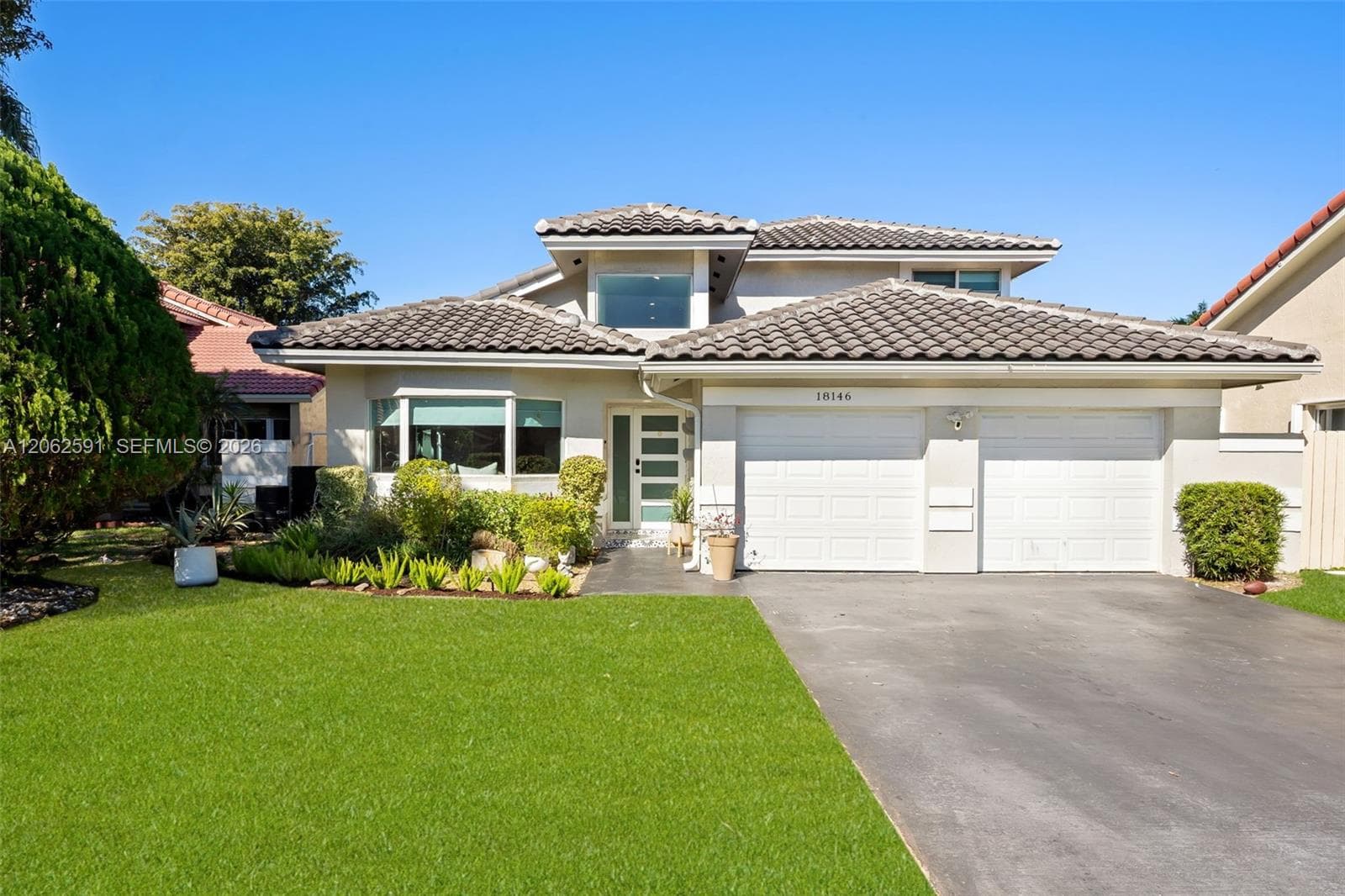 Single-family home at 18146 NW 61st Pl, Hialeah, FL