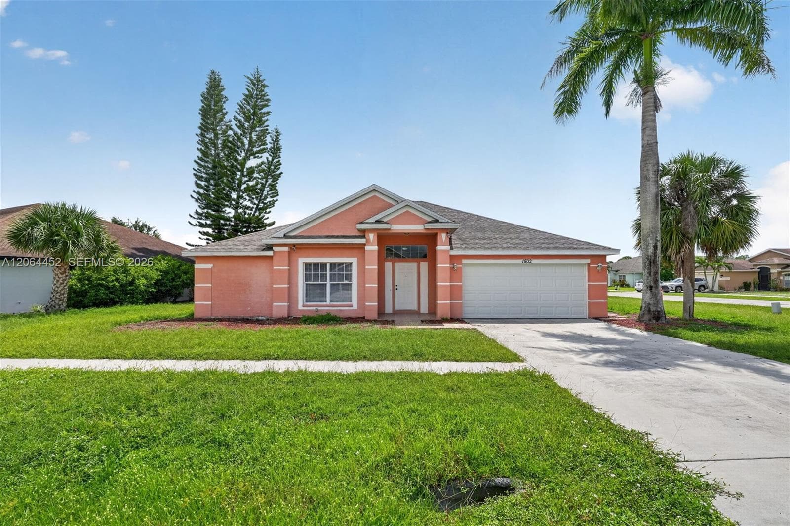 Single-family home at 1502 Scholar CT, Lehigh Acres, FL