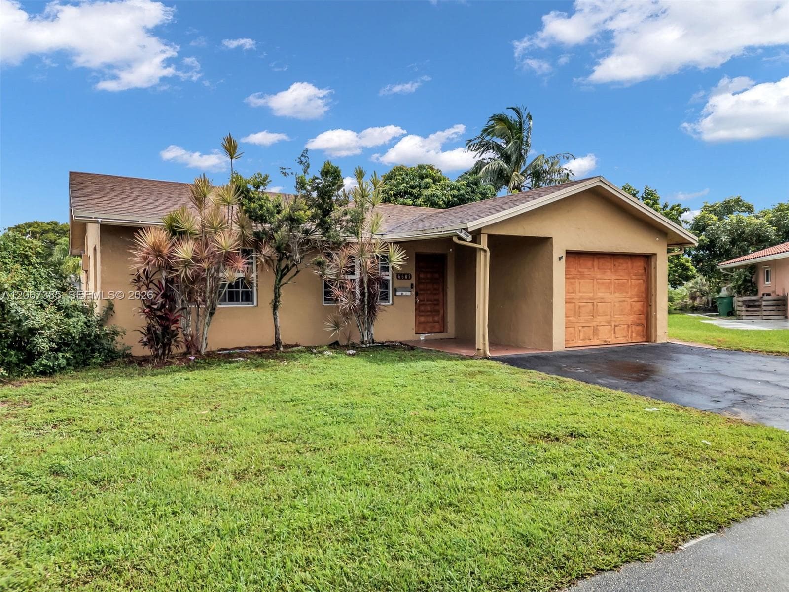 Single-family home at 6605 NW 77th St, Tamarac — photo 1