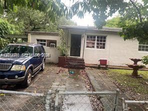 Single-family home at 215 NW 117th St, Miami, FL